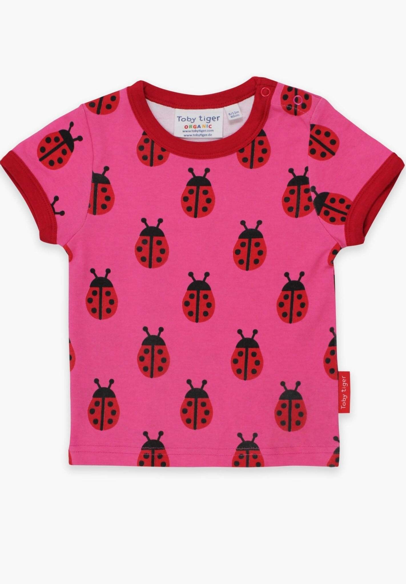 Premium Pink Ladybug Print Baby T-Shirt with Red Trim, GOTS Certified Organic Cotton, Snap Button Neck for Easy Dressing by Toby Tiger at brixbailey.com