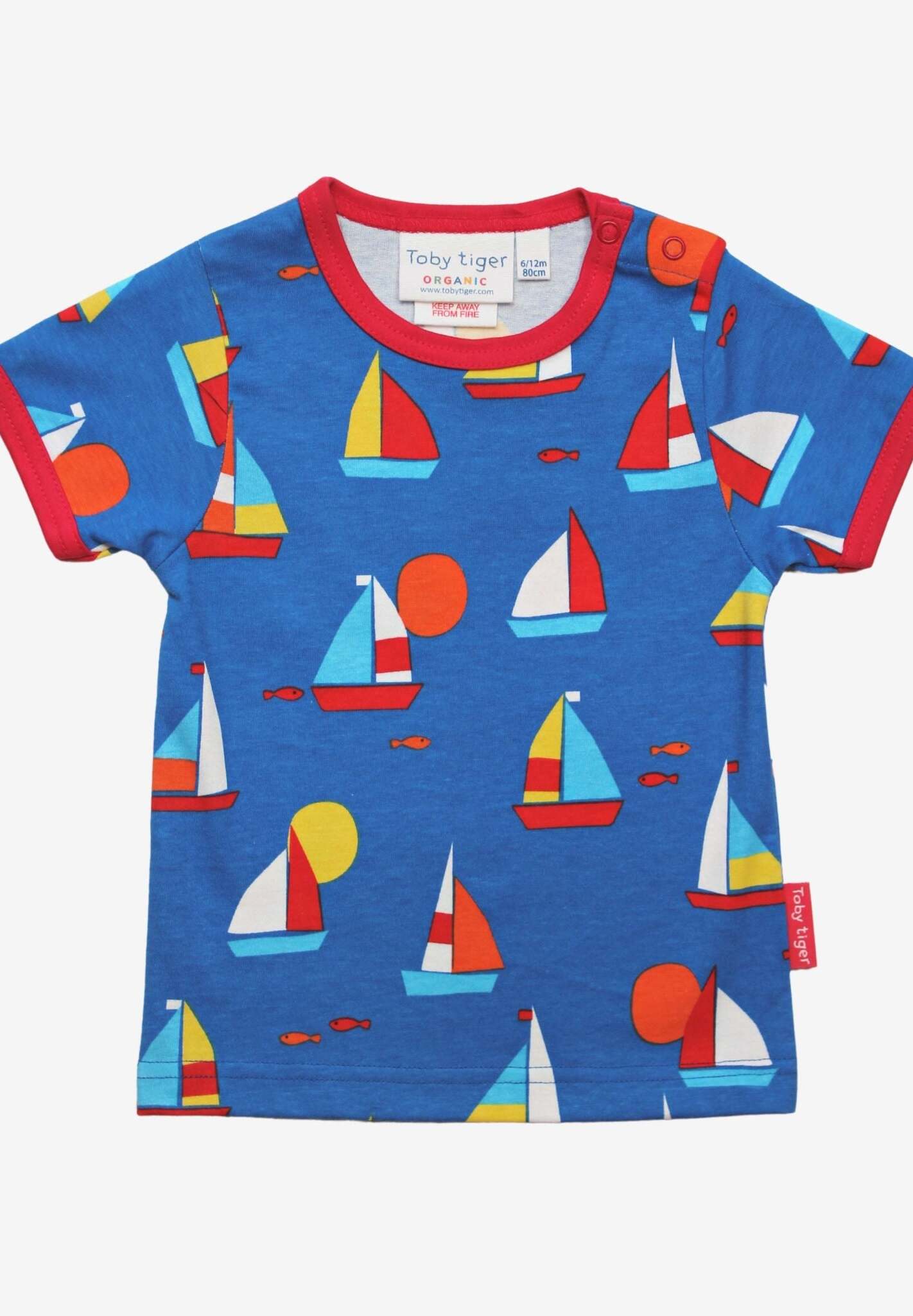 Premium organic kids summer T-shirt with sailboat print, stylish red trim, deep blue GOTS-certified cotton, trendy nautical design by Toby Tiger at brixbailey.com