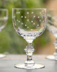 A Set Of Four Crystal Wine Goblets with Stars Design