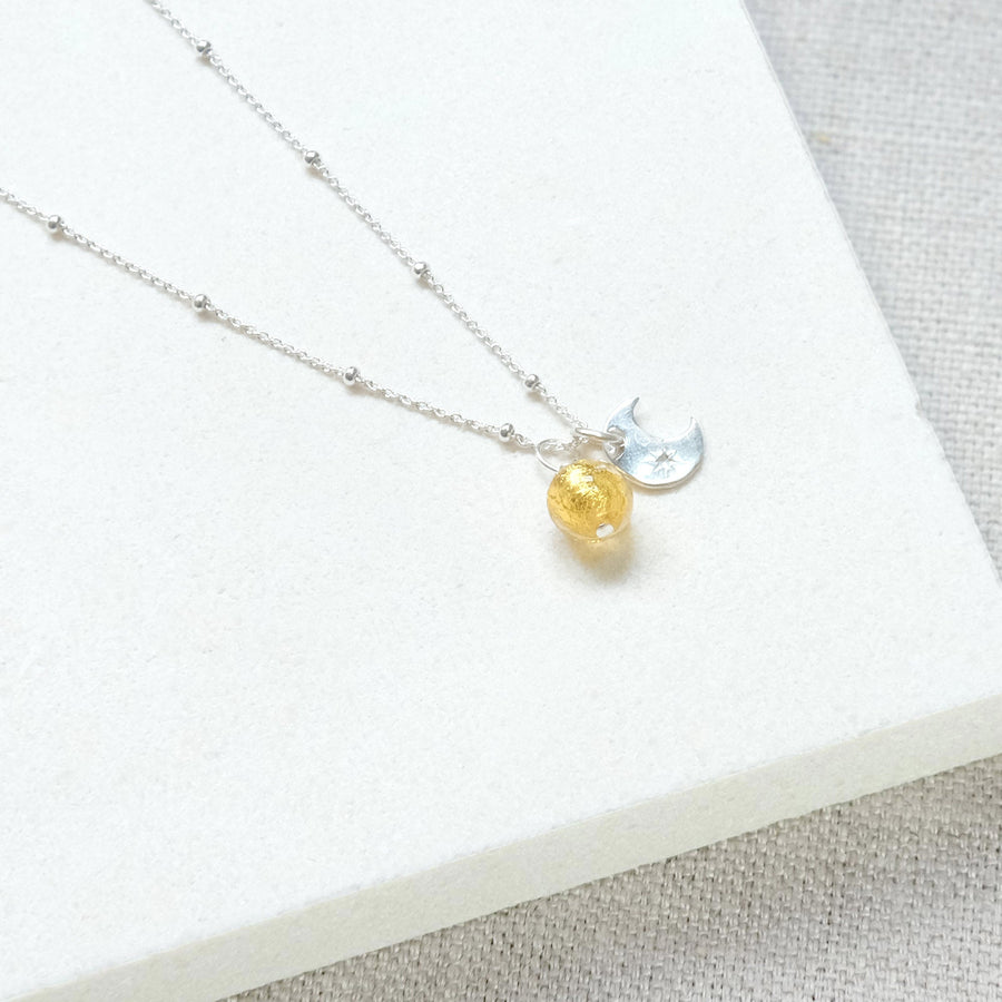 Luxury sun and moon pendant necklace, sterling silver satellite chain with Murano glass charm, dainty stacking jewelry, best-selling celestial necklace by Lezzeri at brixbailey.com