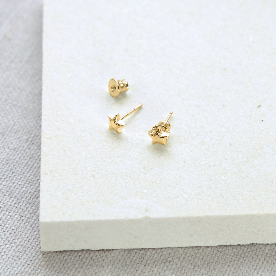 Luxury celestial star stud earrings, gold vermeil, dainty stacking studs with shimmering textured edges by Lezzeri at brixbailey.com