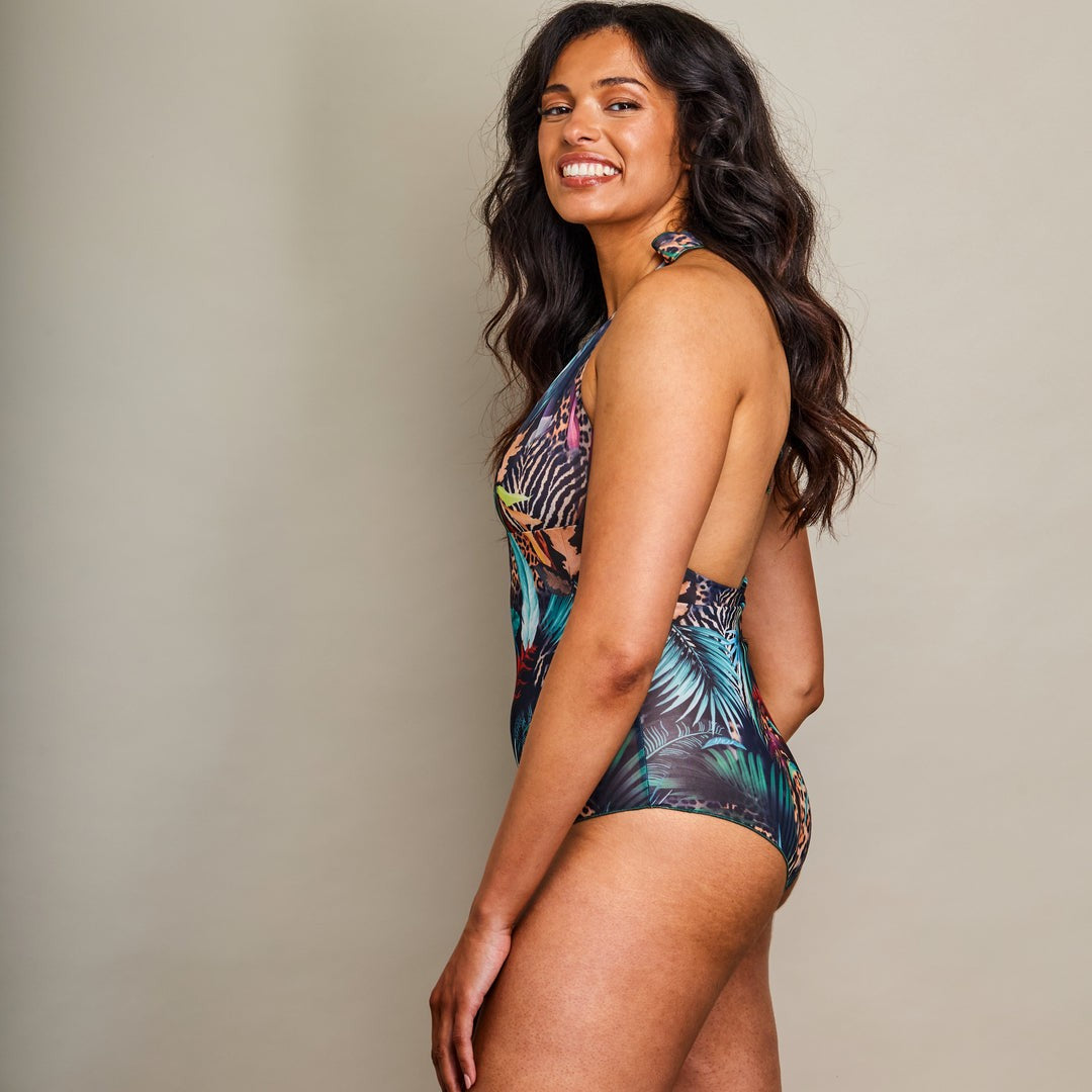 soft morning light on a sustainable tan-through halterneck swimsuit with adjustable straps