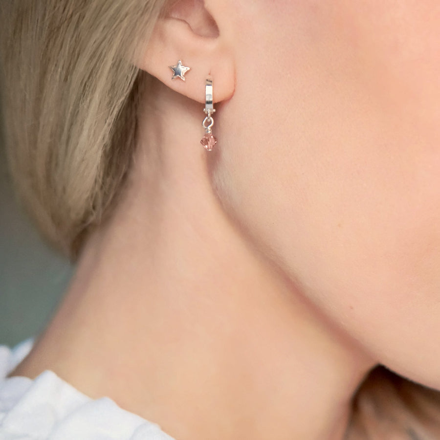 Luxury celestial star stud earrings, dainty sterling silver stacking studs with shimmering textured edges by Lezzeri at brixbailey.com