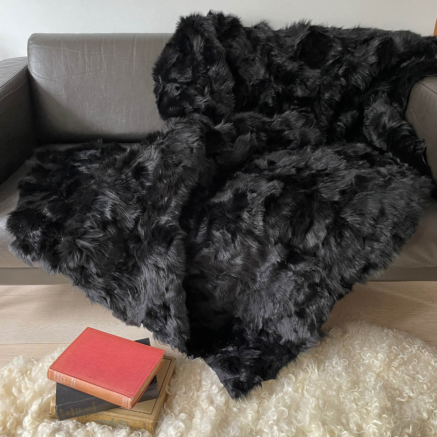 Luxury obsidian black shearling throw, premium Toscana sheepskin rug, stylish dark fur super king bed throw, handcrafted sustainable decor by Wildash London at brixbailey.com