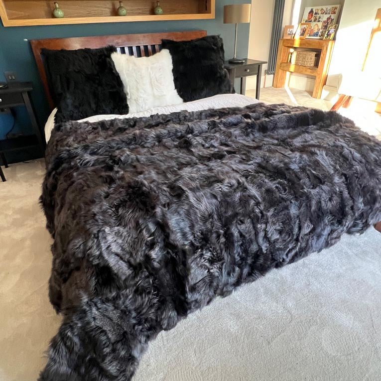 Luxury obsidian black shearling throw or rug, premium Tuscan sheepskin, stylish dark highlights, best-selling super king size by Wildash London at brixbailey.com