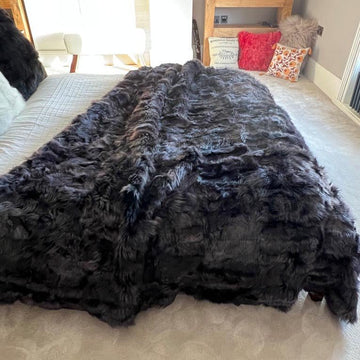 Luxury obsidian black shearling throw, premium Toscana sheepskin rug or bed throw, handcrafted sustainable Tuscan shearling by Wildash London at brixbailey.com