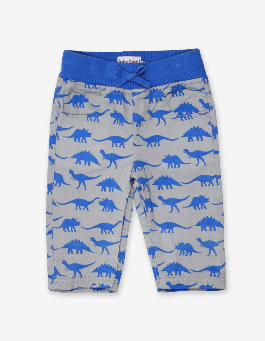 Premium baby cotton pants with playful dinosaur print, elastic waistband, soft jersey lining, cozy and stylish for cool weather by Toby Tiger at brixbailey.com