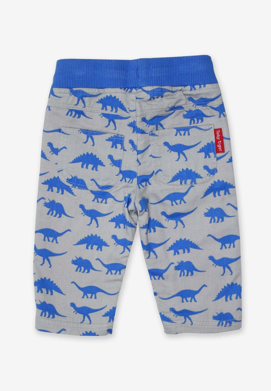 Premium baby cotton pants with playful dinosaur print, soft elastic waistband, cozy jersey lining, eco-friendly dyes by Toby Tiger at brixbailey.com