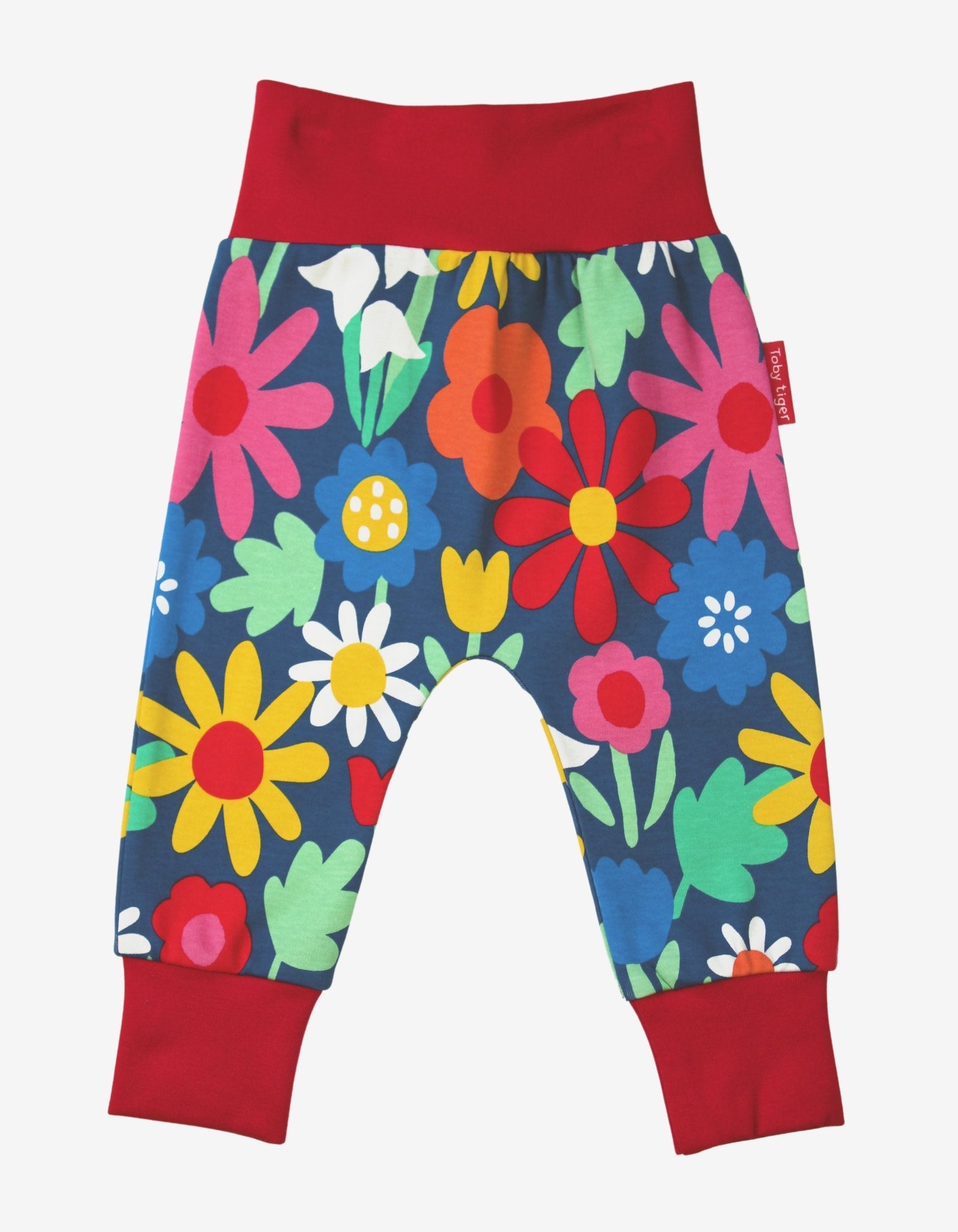 Premium organic cotton kids yoga pants with floral print, dark blue with snowdaisies and tulips, GOTS certified, soft and comfortable by Toby Tiger at brixbailey.com