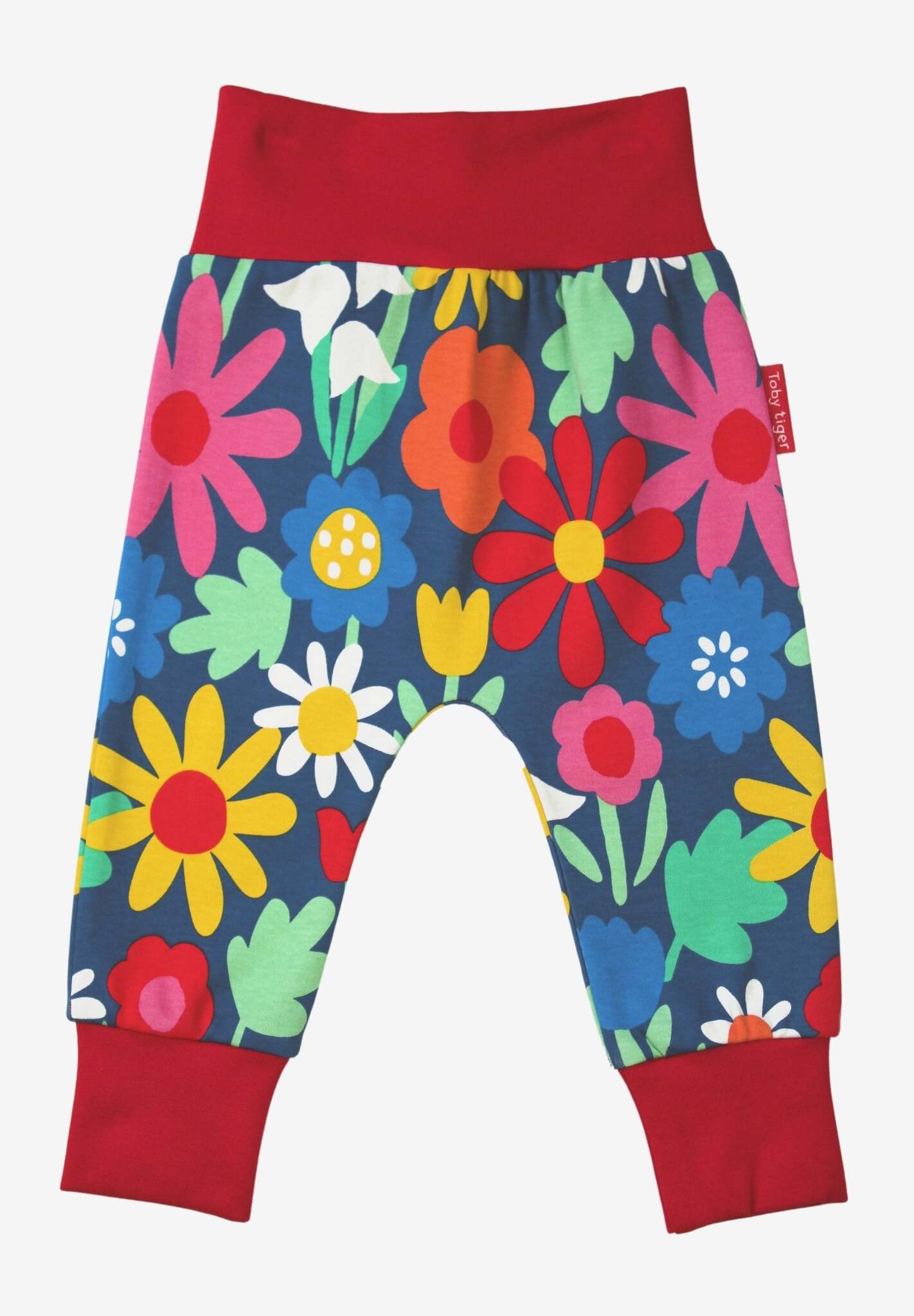 Premium organic cotton kids yoga pants with floral snowdrop daisy tulip print, stylish dark blue, comfortable waist ankle cuffs, GOTS certified by Toby Tiger at brixbailey.com
