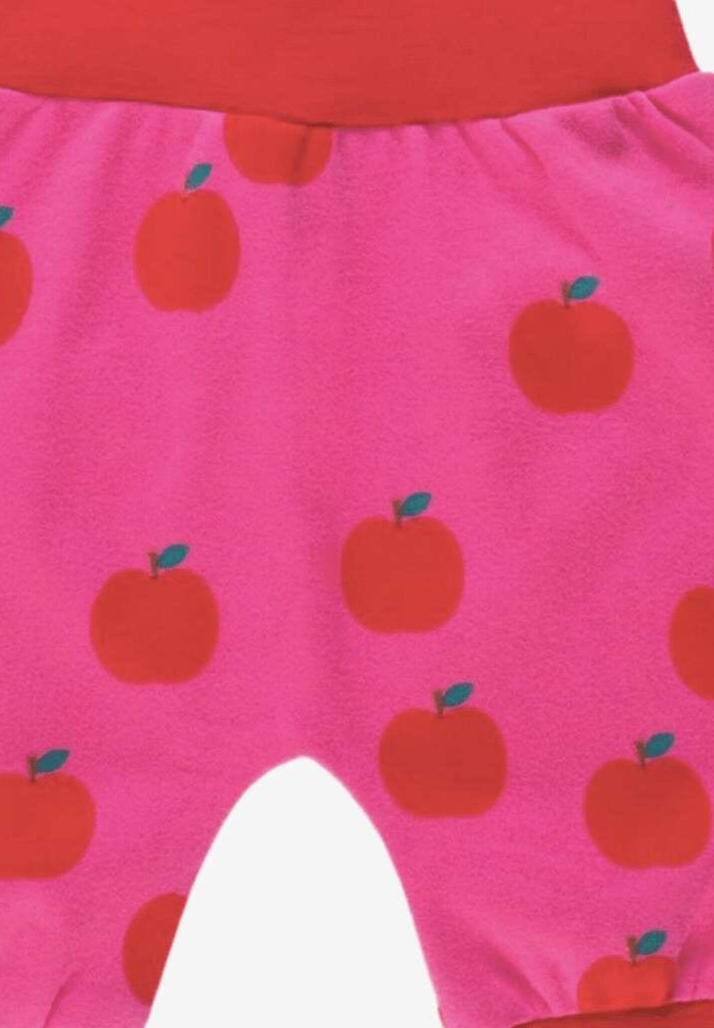 Premium organic cotton kids yoga pants with apple print, stylish red and pink contrast trim, soft comfortable waistband, eco-friendly GOTS certified by Toby Tiger at brixbailey.com