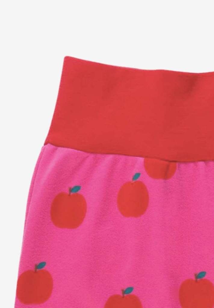 Premium organic cotton kids yoga pants with apple print, stylish red and pink contrast trim, soft GOTS-certified fabric by Toby Tiger at brixbailey.com
