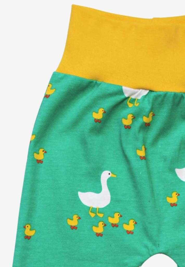 Premium organic cotton kids yoga pants with duck print, playful green and yellow, comfy fold-over waistband, GOTS certified by Toby Tiger at brixbailey.com