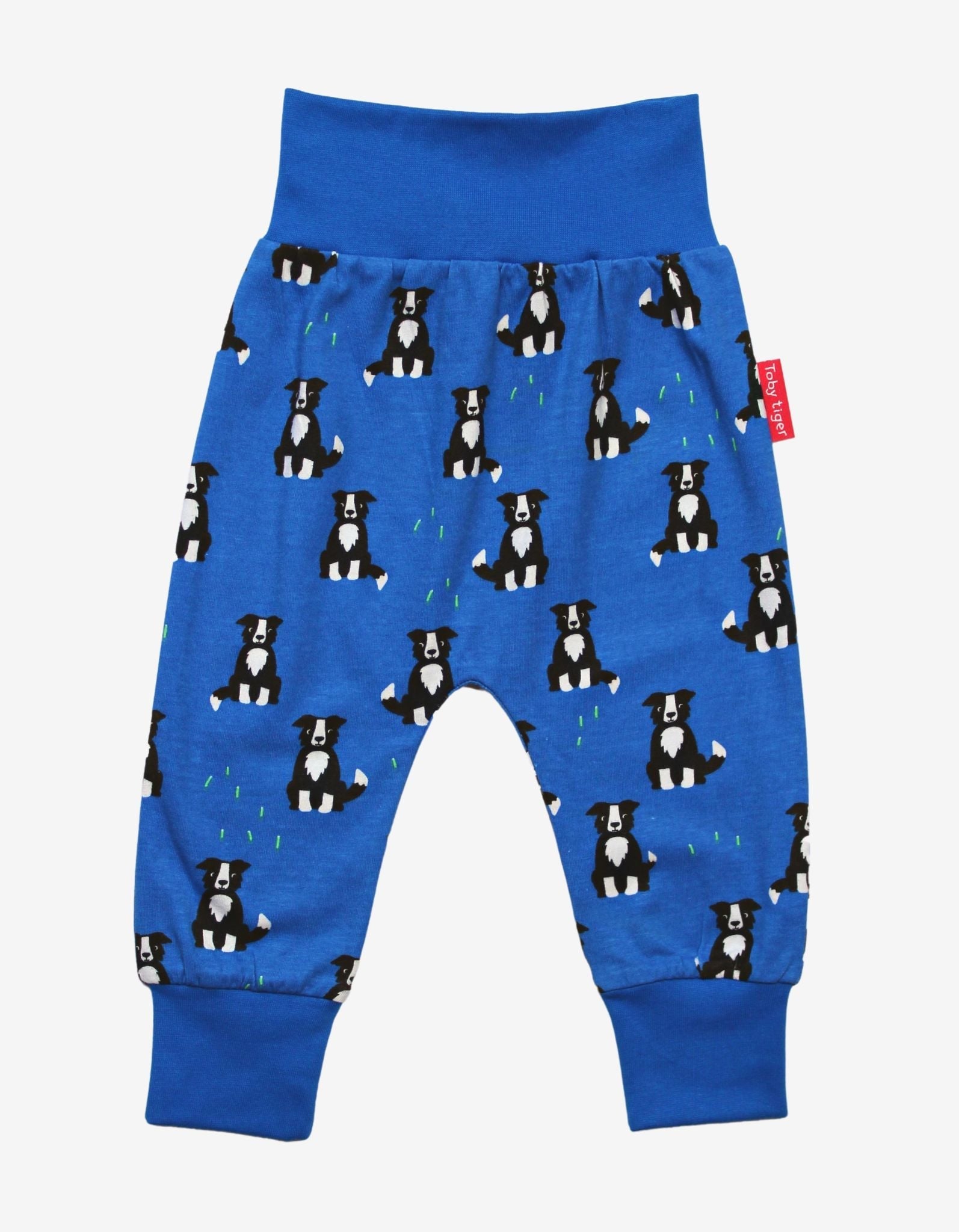 Premium organic cotton kids yoga pants with dog print, stylish green ankle cuffs, comfortable for play and relaxation by Toby Tiger at brixbailey.com