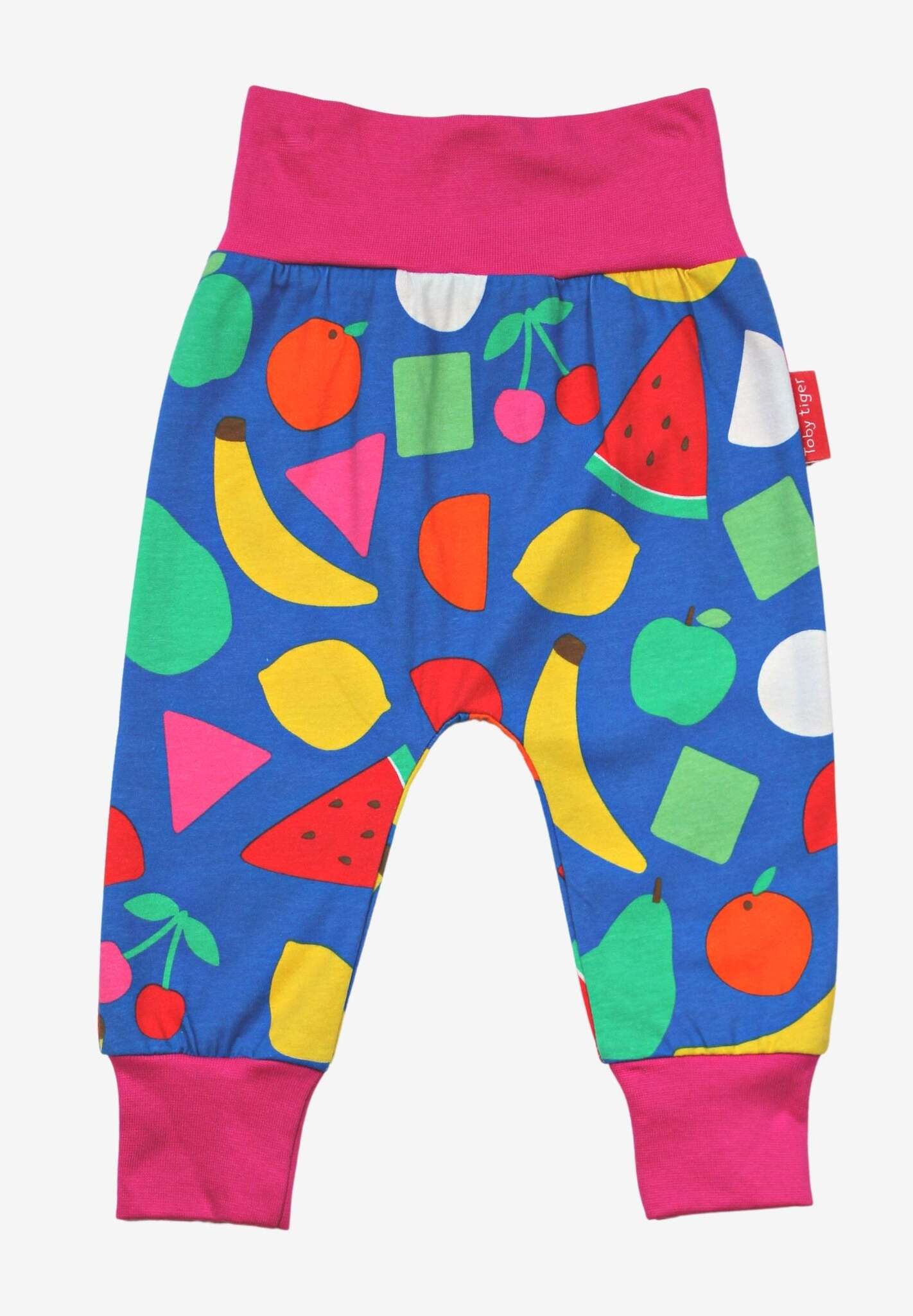 Premium kids yoga pants with vibrant fruit print, stylish and comfortable, made from 100% organic GOTS-certified cotton by Toby Tiger at brixbailey.com
