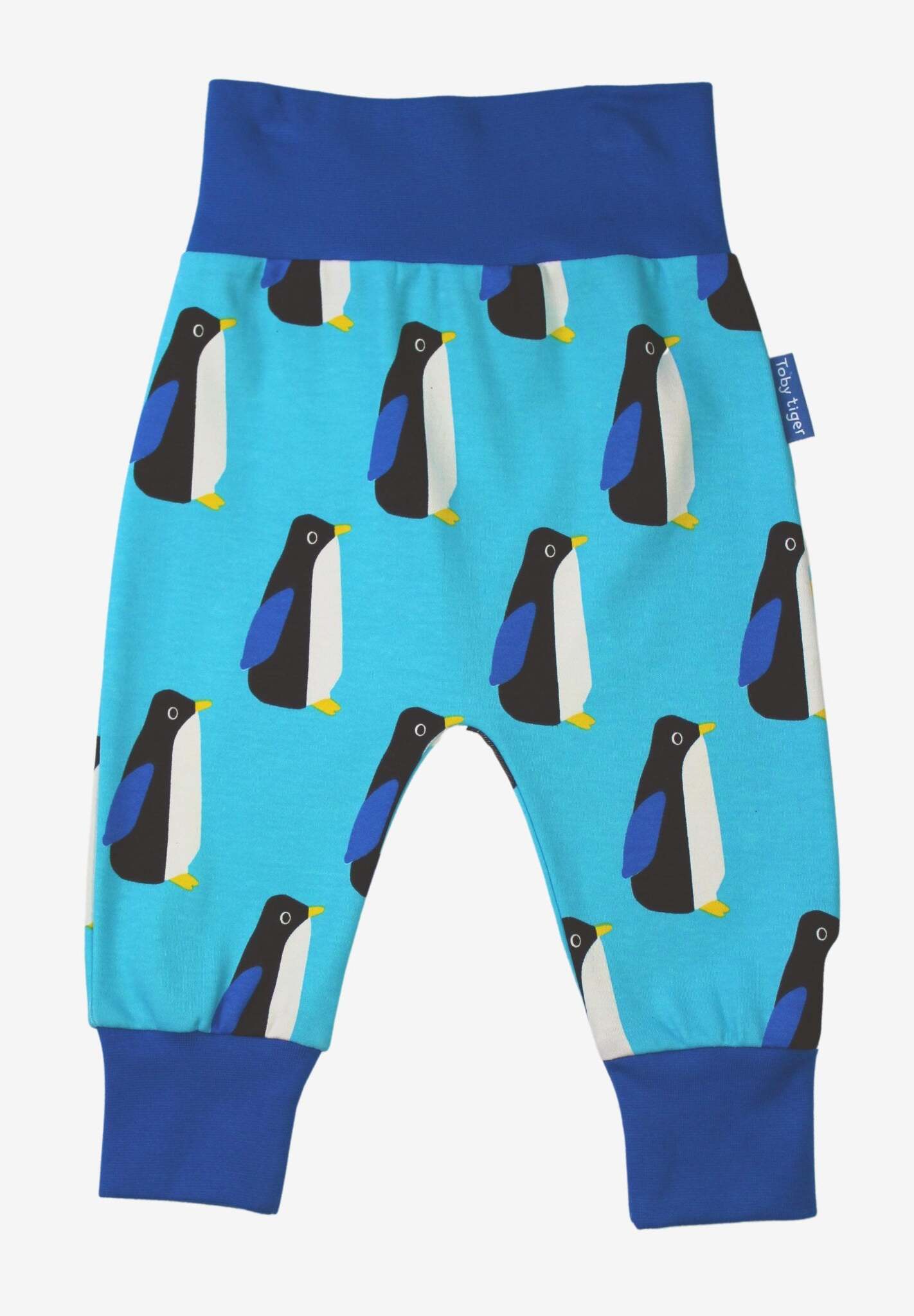 Premium baby blue organic cotton yoga pants with penguin print, elastic waistband, ankle cuffs, soft stretchy fabric, GOTS certified by Toby Tiger at brixbailey.com