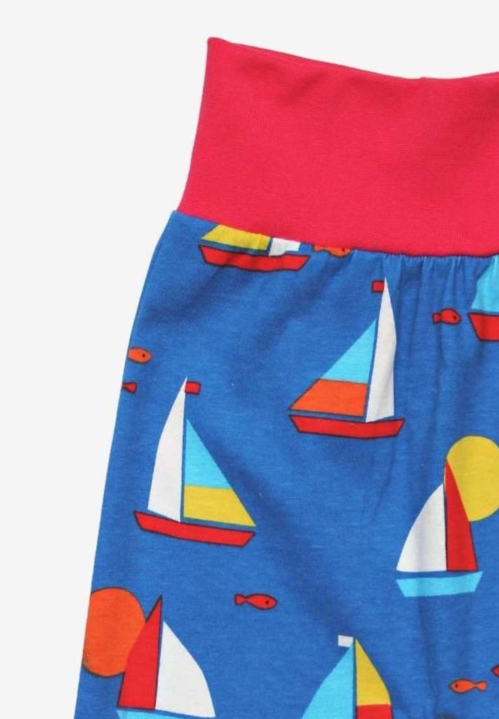 Premium organic cotton kids yoga pants with sailboat print, stylish red waistband, comfortable ankle cuffs, GOTS certified, soft and breathable by Toby Tiger at brixbailey.com