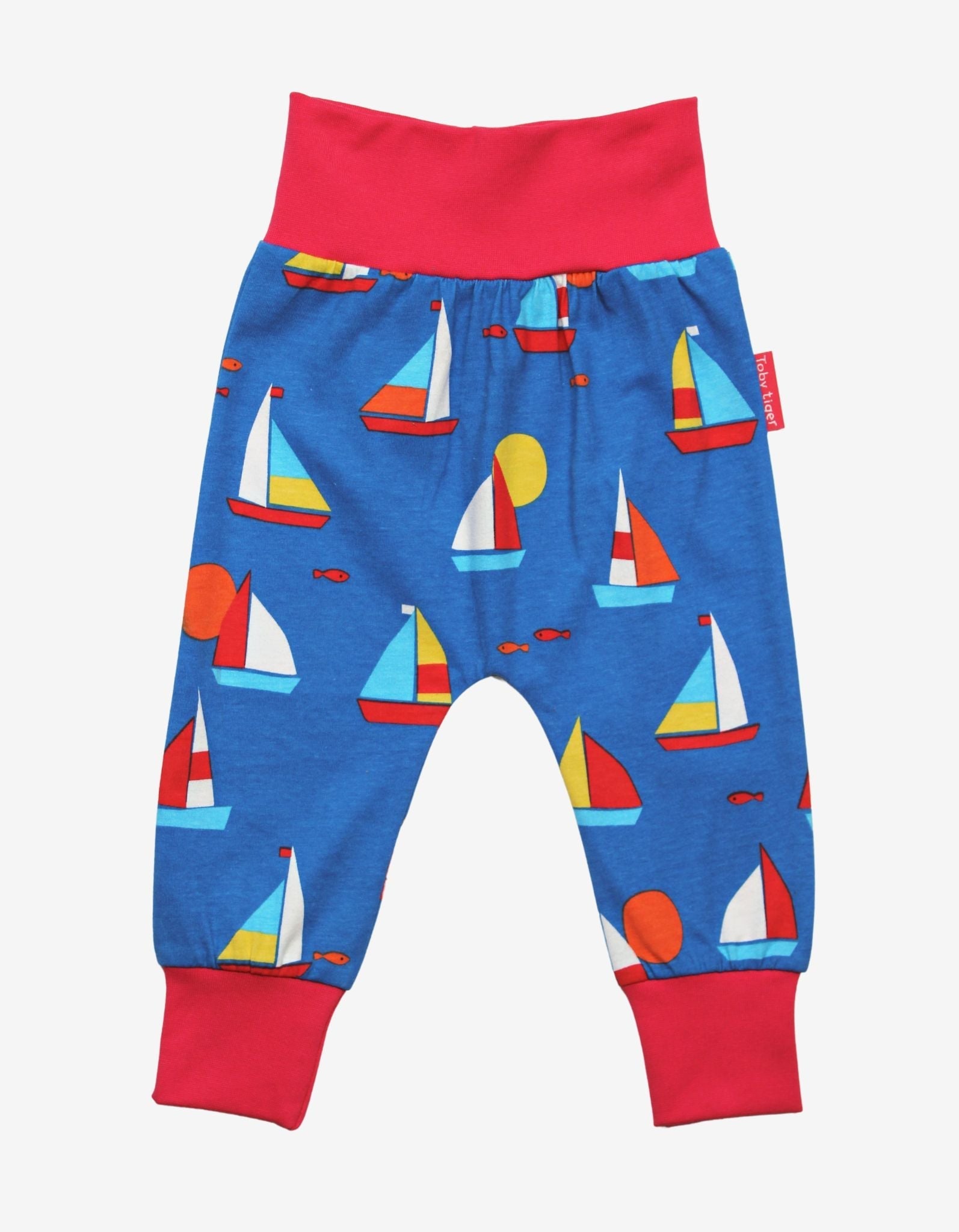 Premium organic cotton kids yoga pants with sailboat print, stylish red waistband, comfortable ankle cuffs, GOTS certified, trendy and breathable by Toby Tiger at brixbailey.com