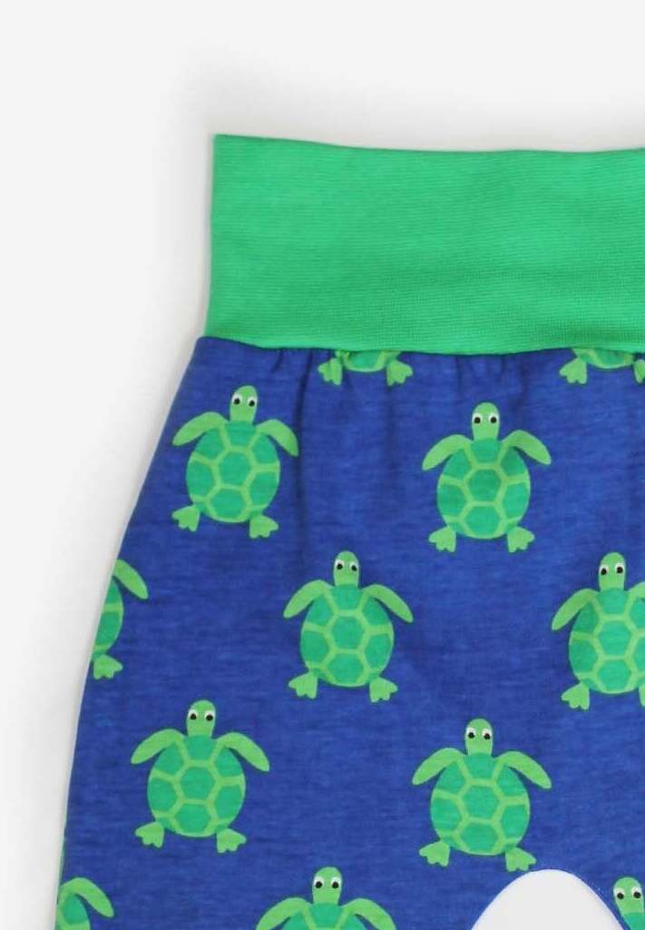 Premium baby pants with turtle applique, organic cotton, soft GOTS-certified fabric, flexible waistband, neutral tones by Toby Tiger at brixbailey.com