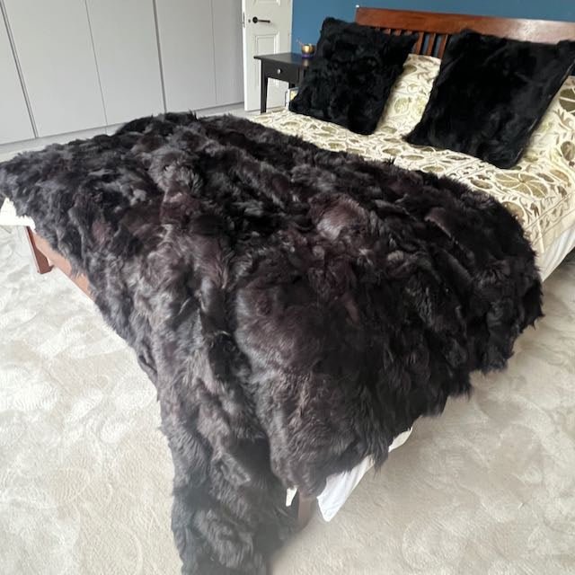 Luxury dark chocolate Tuscan shearling throw, premium sheepskin fur blanket, stylish sustainable home accent by Wildash London at brixbailey.com