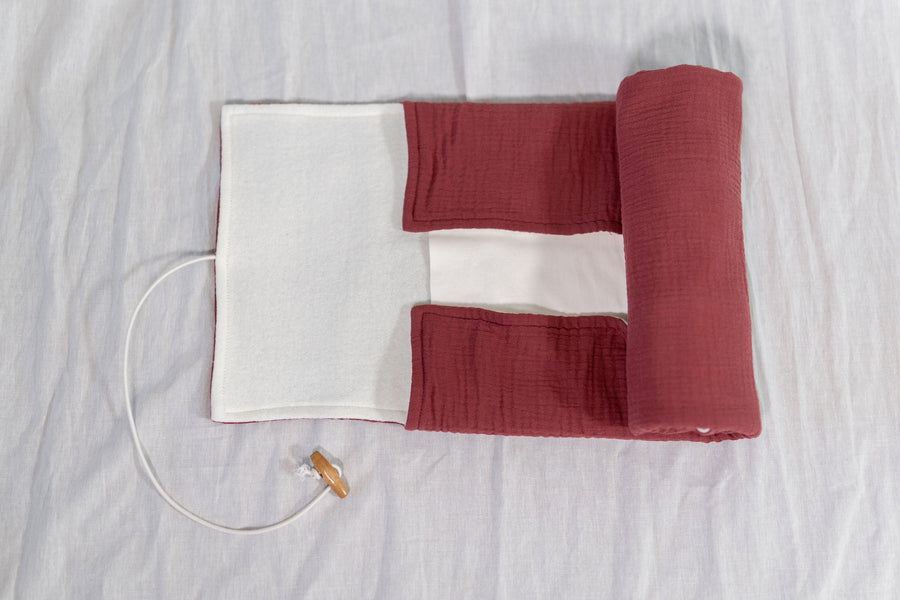 Premium portable changing pad, 100% plastic-free, sustainable, with built-in pocket for wipes and liners, compact and stylish by Mata Origin at brixbailey.com