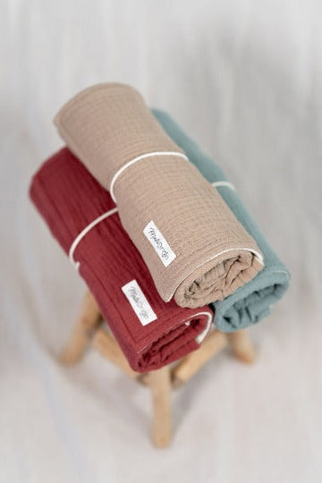 Premium on-the-go changing pad, wool moisture barrier with included muslin insert, compact roll-up design, plastic-free, sustainable, supports inclusive workshops by Mata Origin at brixbailey.com