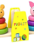 winnie the pooh and piglet wooden stacker with soft morning light on a cozy nursery rug