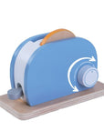 confident shot of a wooden kids toaster set with toast and butter on a bright playroom table