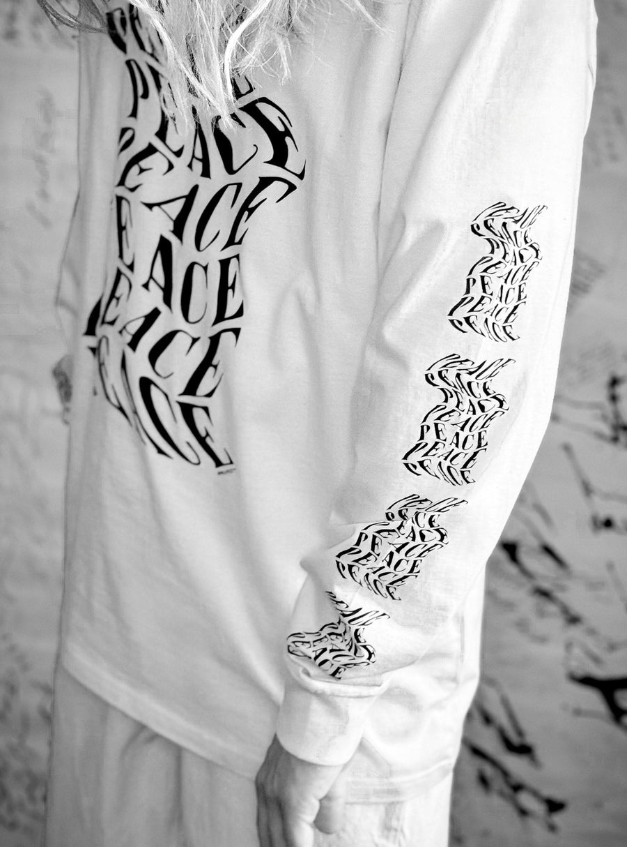 Luxury oversized off-white long sleeve with matte black graphics, premium 200 gsm organic cotton, handcrafted limited edition by WWOOLLFF CO. at brixbailey.com