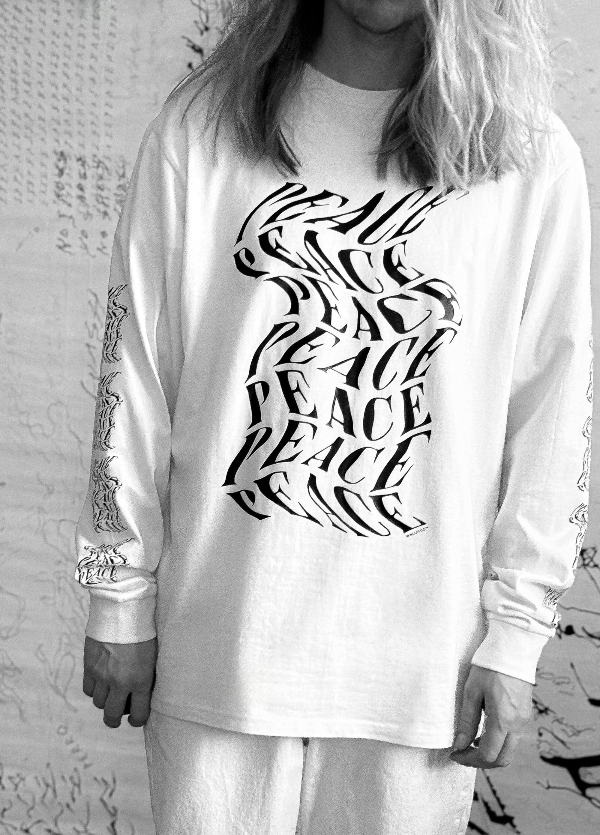 Luxury oversized off-white long sleeve with matte black graphics, premium 200 gsm organic cotton, handcrafted limited edition unisex top by WWOOLLFF CO. at brixbailey.com