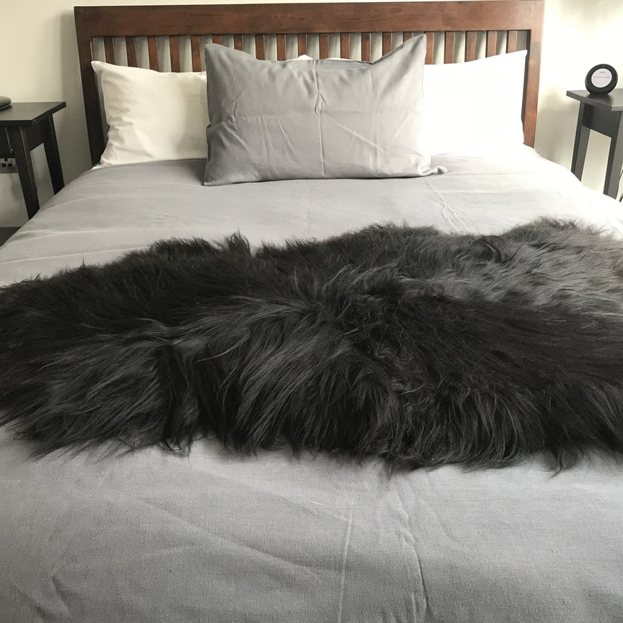 Icelandic natural black undyed sheepskin hide, premium eco-tanned luxury rug, sustainably sourced, soft and biodegradable by Wildash London at brixbailey.com