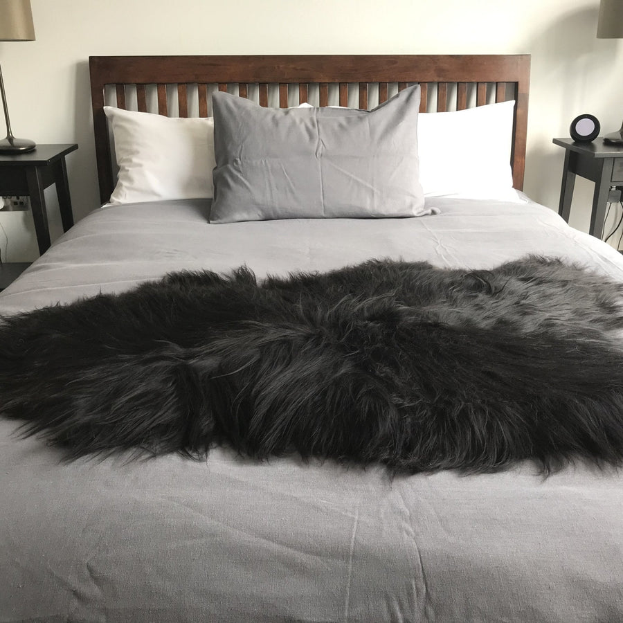 Icelandic natural black undyed sheepskin hide, premium eco-tanned luxury rug, sustainably sourced, soft and biodegradable by Wildash London at brixbailey.com
