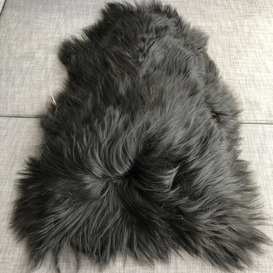 Icelandic natural black undyed sheepskin hide, premium eco-tanned luxury rug, sustainably sourced, soft and biodegradable by Wildash London at brixbailey.com