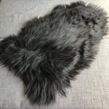 Icelandic natural black undyed sheepskin hide, premium eco-tanned luxury rug, sustainably sourced, soft and biodegradable by Wildash London at brixbailey.com