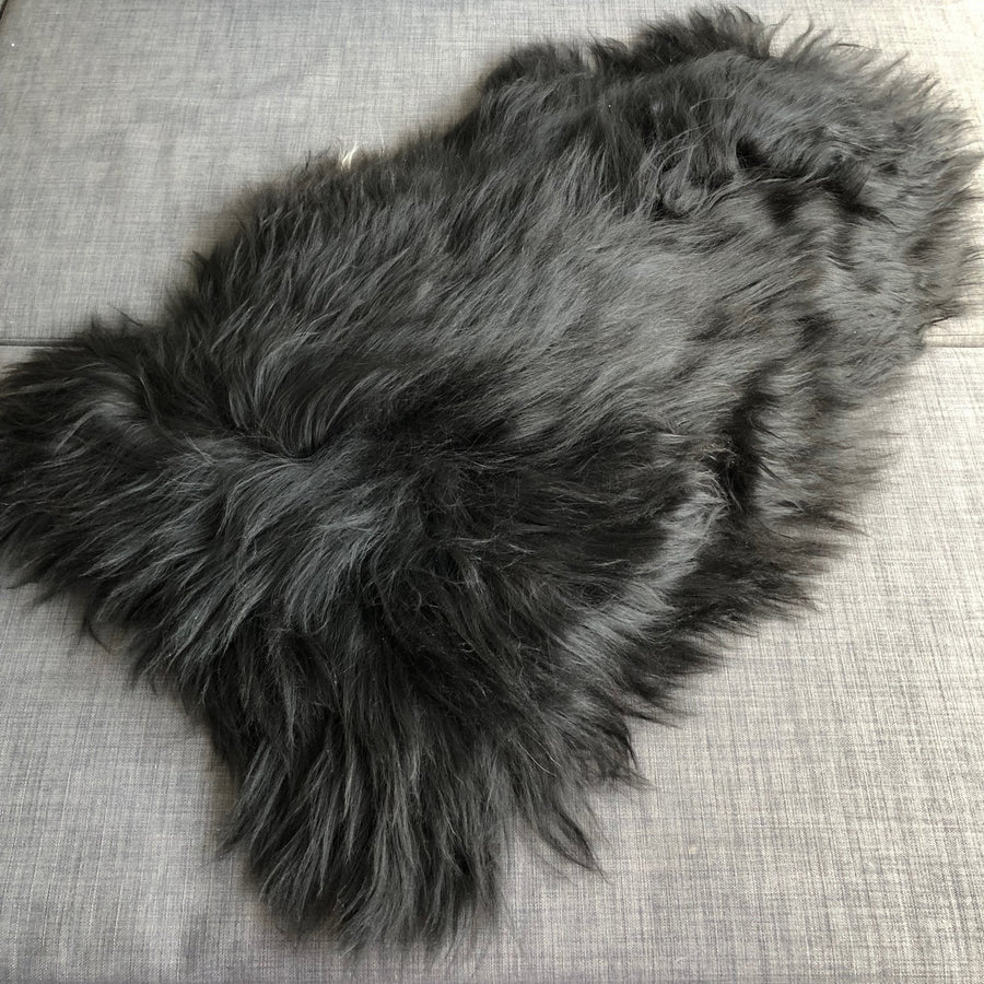 Icelandic natural black undyed sheepskin hide, premium eco-tanned luxury rug, sustainably sourced, soft and biodegradable by Wildash London at brixbailey.com