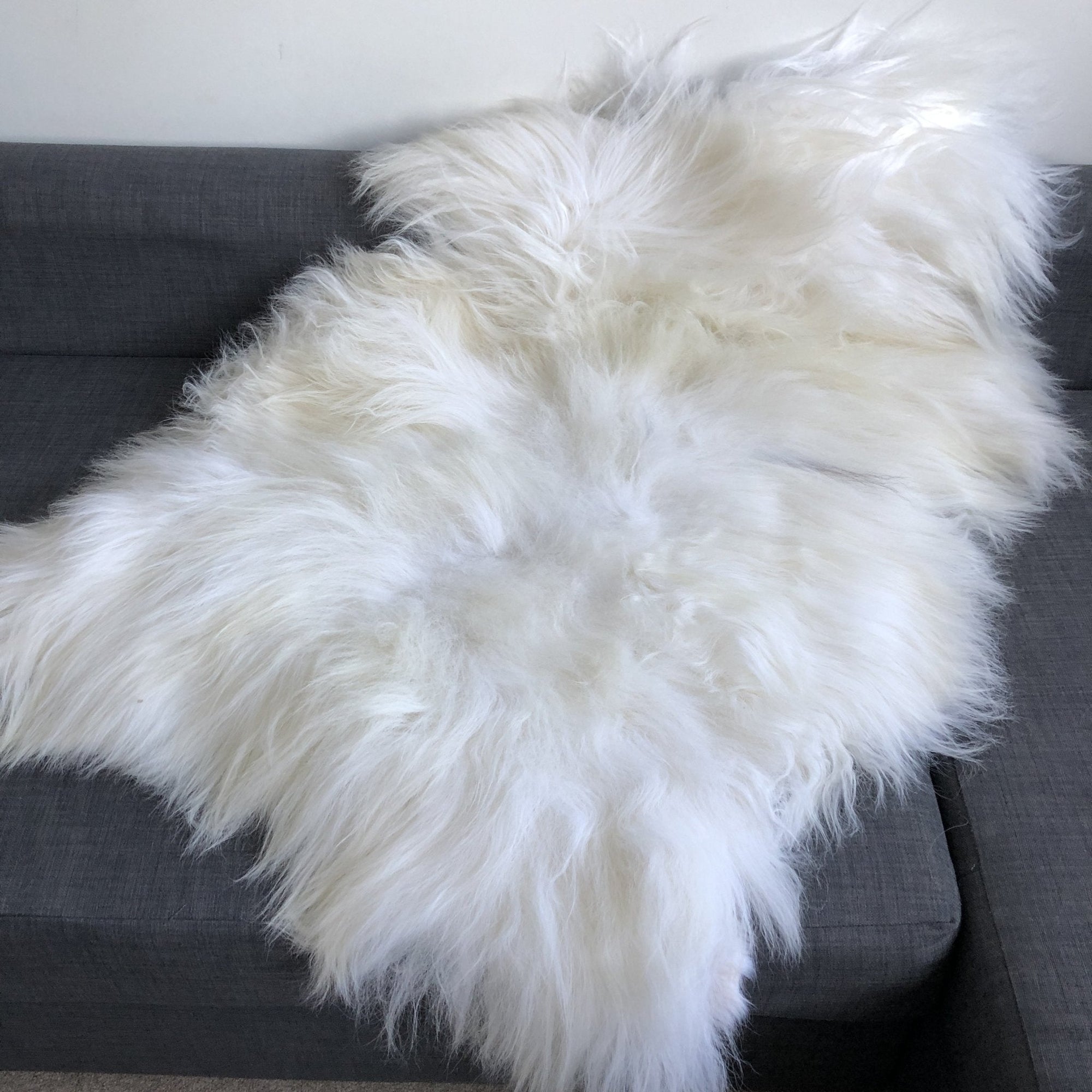 Luxury Icelandic white long fur sheepskin rug, premium 100% natural undyed sheepskin throw, handcrafted for warmth and texture by Wildash London at brixbailey.com