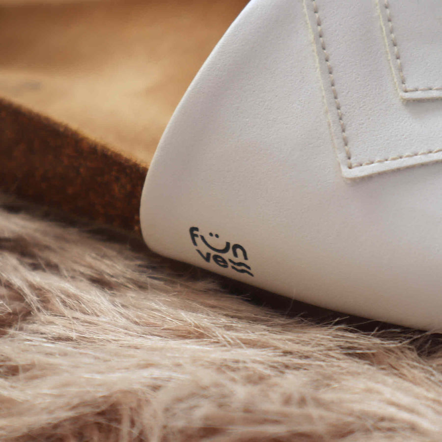 Premium white vegan sandals with comfortable straps, cushioned footbed, slip-resistant sole, sustainable fair fashion by Fünve at brixbailey.com